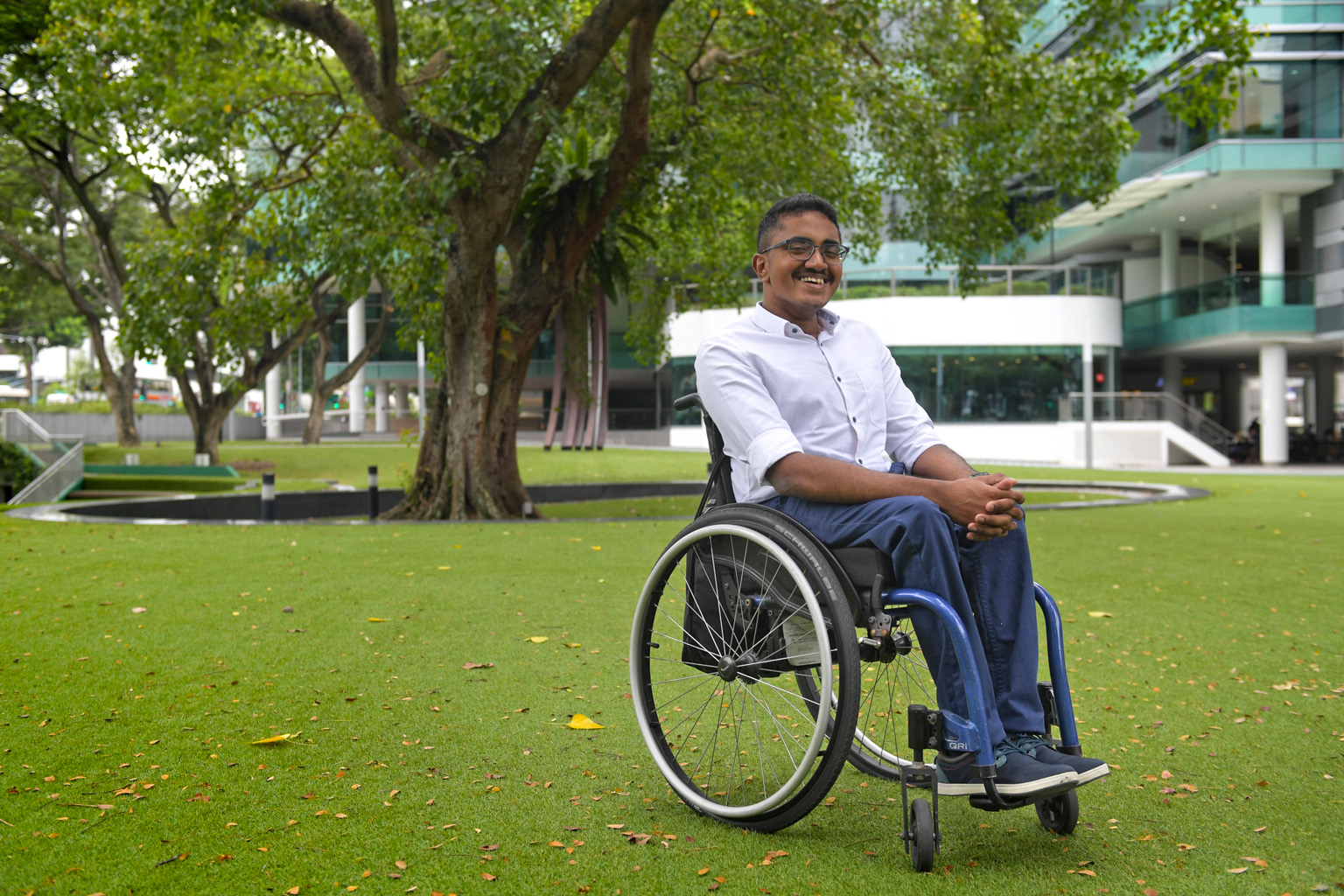 Mr Najulah Mohamed (right) volunteered to collect data, through sensors attached to his wheelchair, on routes accessible to users of mobility aids.
