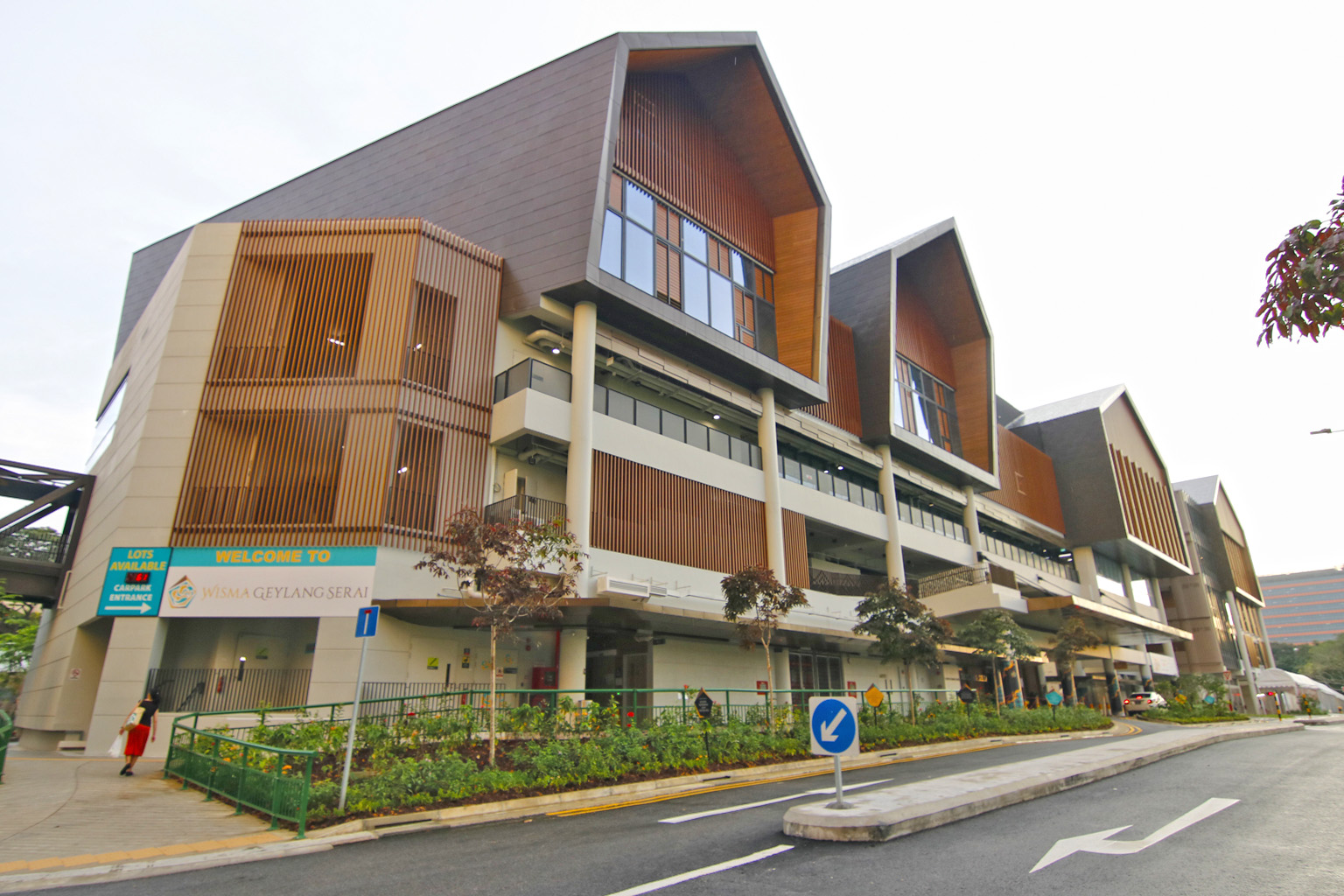 Senior Minister of State for Defence and Foreign Affairs Maliki Osman (above) said autonomous robots like the one shown here may be used for security patrols at Wisma Geylang Serai (top).