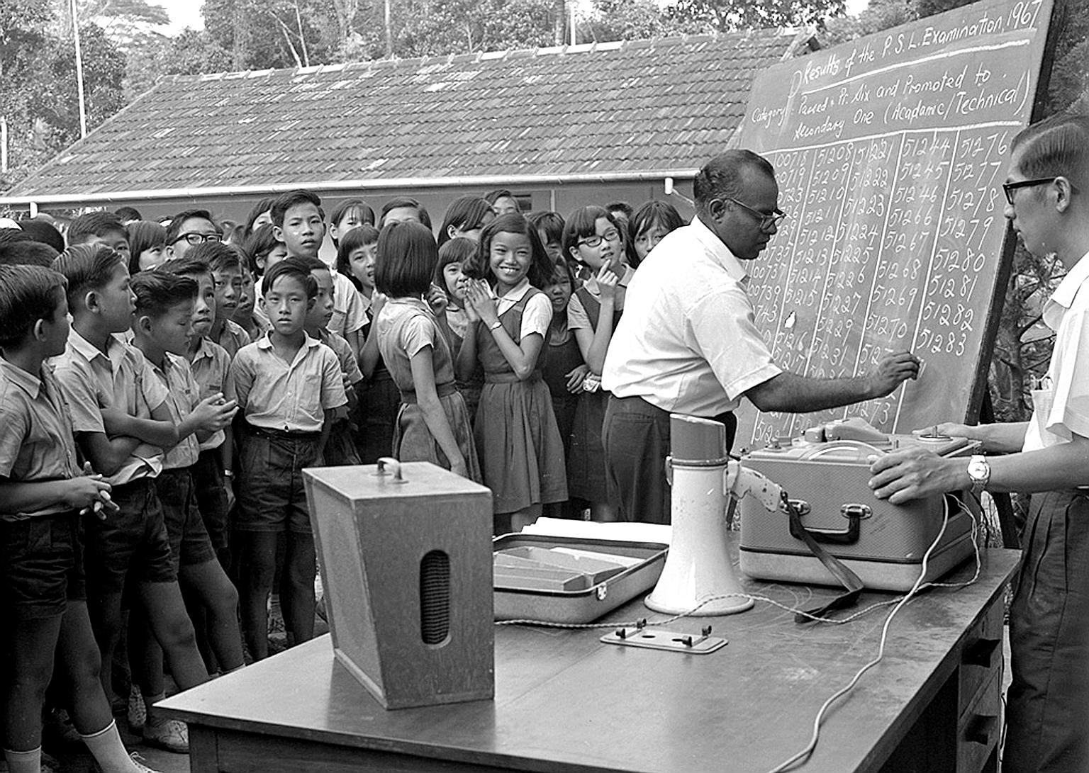 Exam stress: Pupils looking at their examination results written on a blackboard for all to see at the River Valley English School in Singapore on Nov 16, 1967.