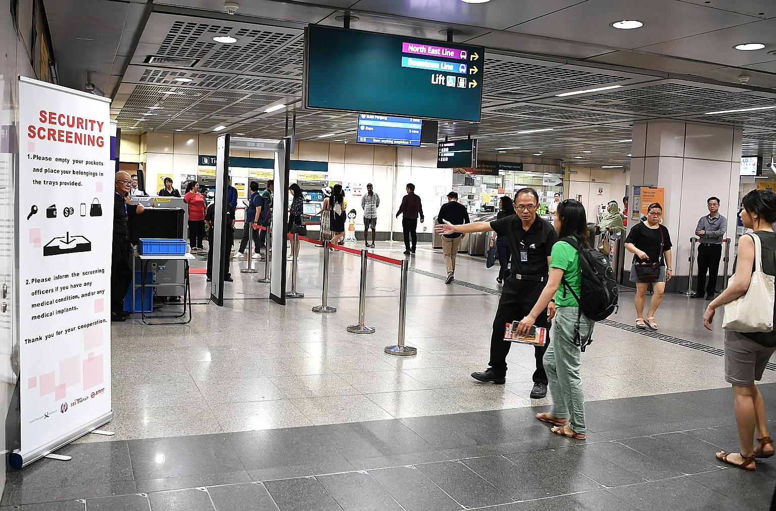 A commuter at Little India MRT station being directed to go through a security screening on the first day of the trial yesterday. The Land Transport Authority said the trial will be conducted at up to six stations across the rail network and that not