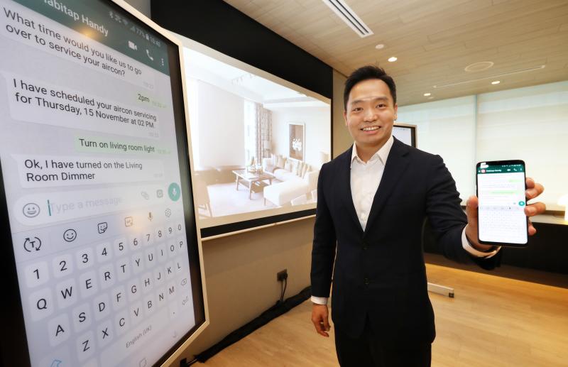 Habitap CEO and founder Franklin Tang demonstrating the features of Habitap Handy, an AI-powered assistant that can accept instructions via WhatsApp to perform tasks for a smart home powered by Habitap's digital living platform.