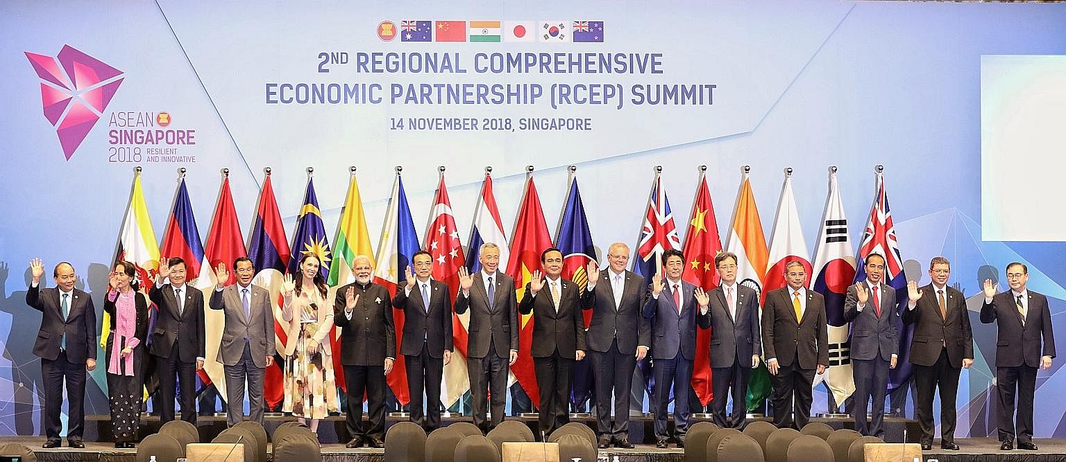 Leaders pause for a photo at the Regional Comprehensive Economic Partnership (RCEP) Summit here yesterday. With Prime Minister Lee Hsien Loong are (from left) Vietnamese Prime Minister Nguyen Xuan Phuc, Myanmar State Counsellor Aung San Suu Kyi, Laot