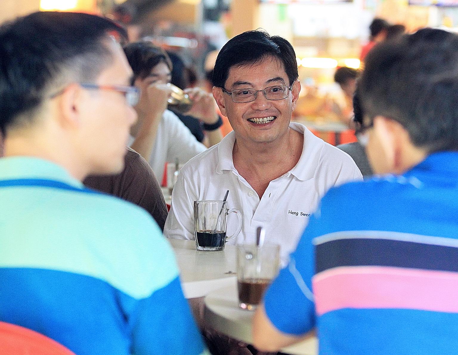 Mr Heng Swee Keat, an MP for Tampines GRC, meeting residents at a coffee shop in Tampines in 2011. Mr Heng has said he hopes to be "able to engage Singaporeans from all walks of life".