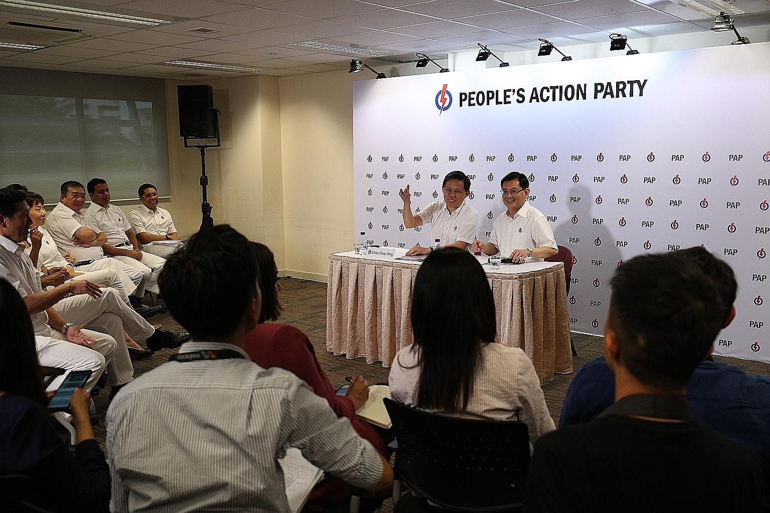 People's Action Party first assistant secretary-general Heng Swee Keat (right) and second assistant secretary-general Chan Chun Sing at the party's media conference on Friday to announce the new line-up of the party's Central Executive Committee.