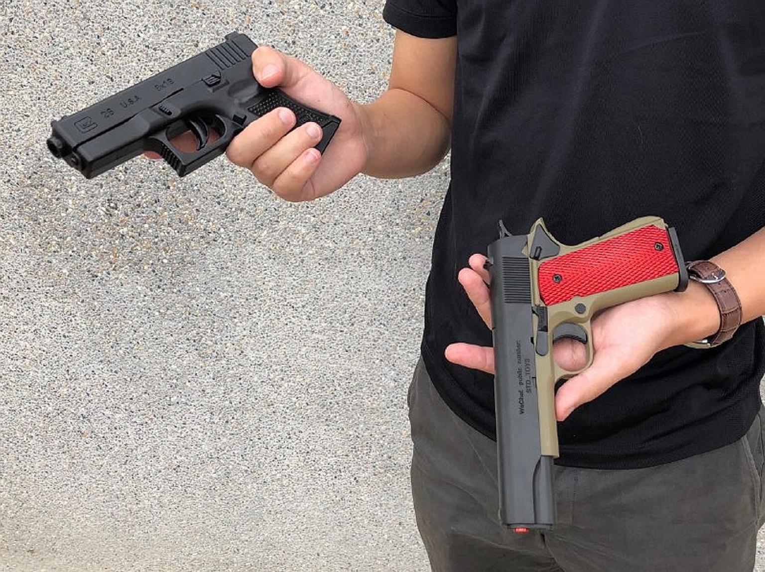 Replicas of a Glock pistol (left) and 1911 pistol. Such guns have been in the news this year, with four instances of the authorities seizing airsoft guns, along with stun guns, that were smuggled into Singapore.