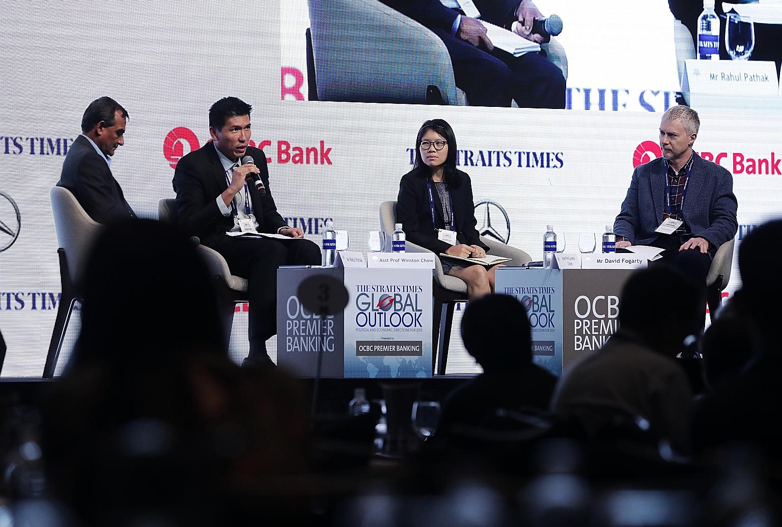 (From left) Moderator and ST associate editor Rahul Pathak, Assistant Professor Winston Chow of the National University of Singapore, Assistant Professor Lynette Cheah of the Singapore University of Technology and Design, and ST assistant foreign edi