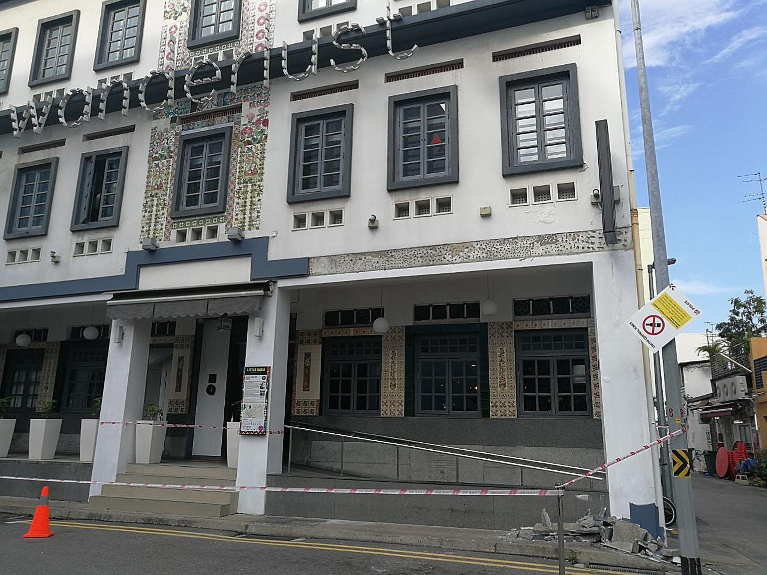 Slabs from the plaster strip that fell can be seen at a corner of the cordoned-off area outside Wanderlust Hotel in Dickson Road.