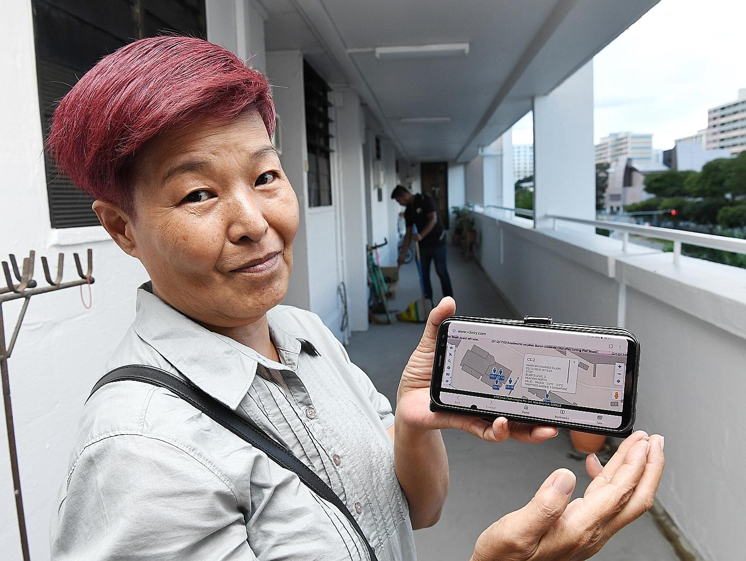 Cleaning supervisor Sally Lim showing how the app tracks a cleaner's progress through a block of flats. Since rolling out its estate monitoring system in September, Tampines Town Council has seen a drop in the number of residents complaining about a 
