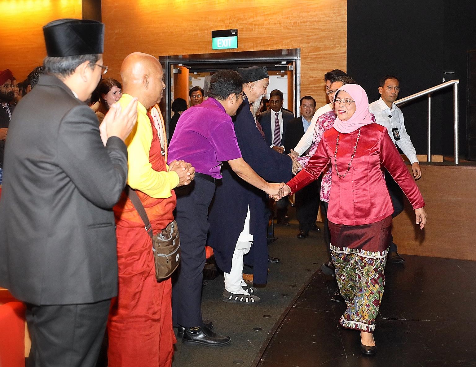 President Halimah Yacob meeting interfaith leaders at the launch yesterday of Faithfully Asean, an inaugural regional interfaith exchange programme.