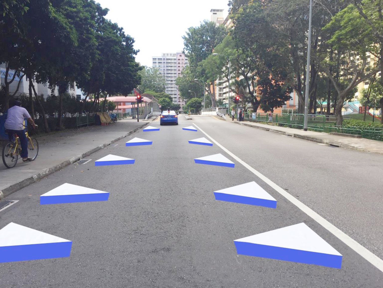 An artist's impression of the new three-dimensional road markings that will go on trial at the end of the month at the Whampoa Drive Silver Zone. The 3D images make the road look narrower and encourage drivers to slow down, said the Land Transport Au