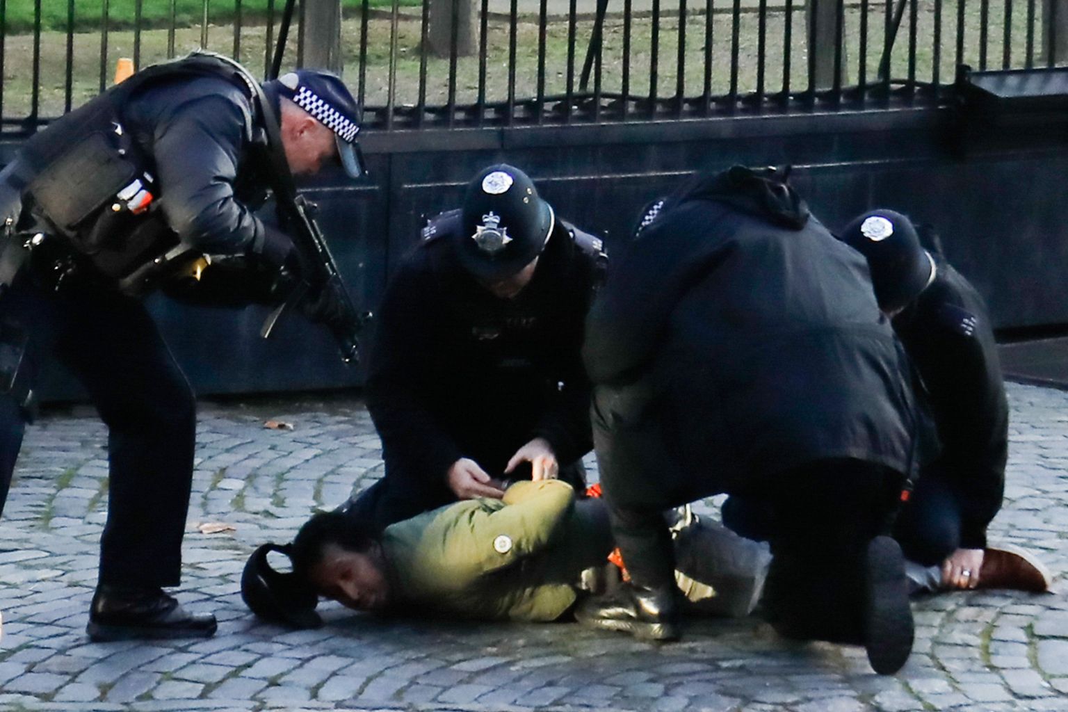 Armed British police use stun gun on man inside grounds of parliament ...
