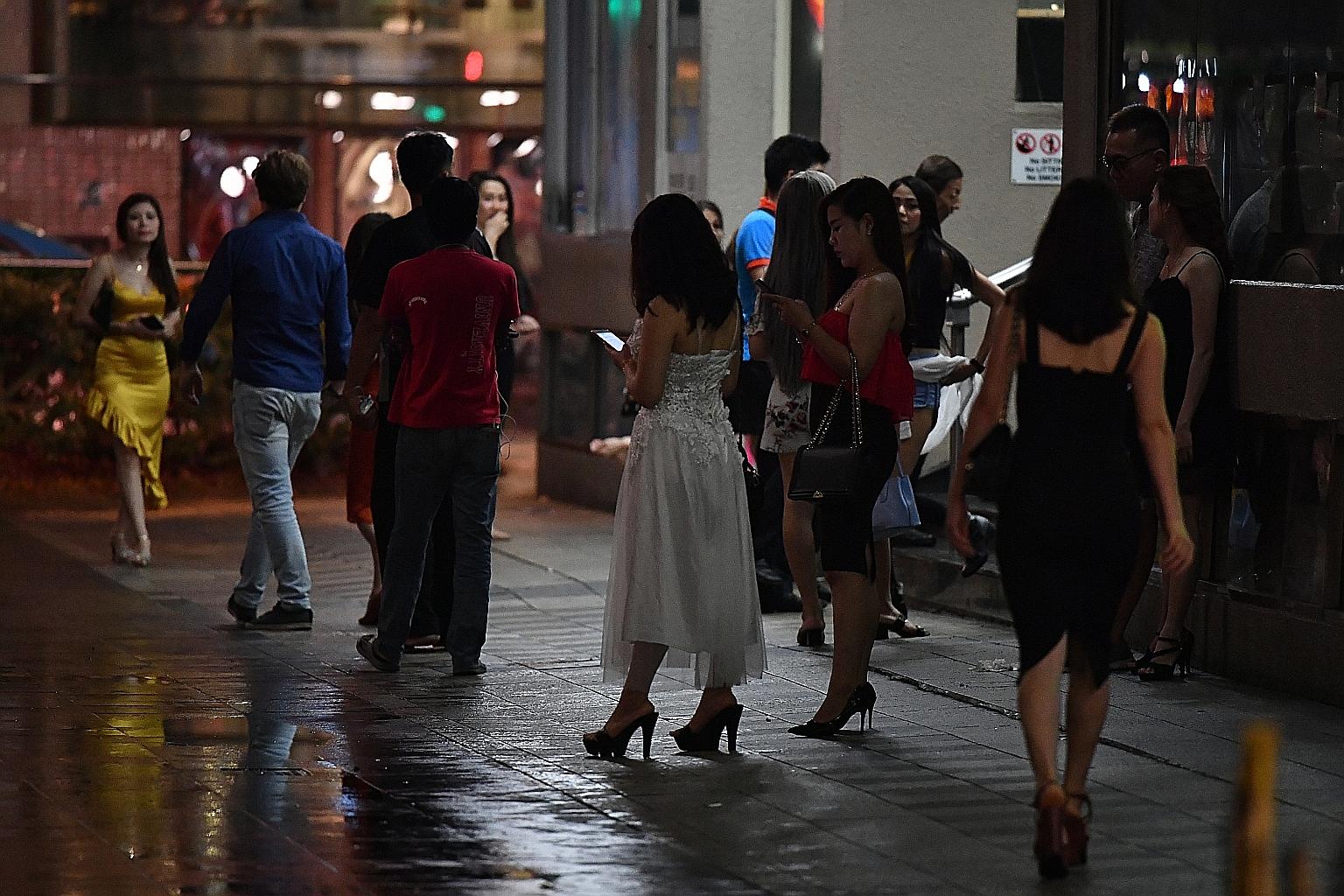 The scene late at night outside Orchard Towers. Philippine Embassy officials suspect a syndicate in Singapore could be behind the trafficking of Filipino women here.