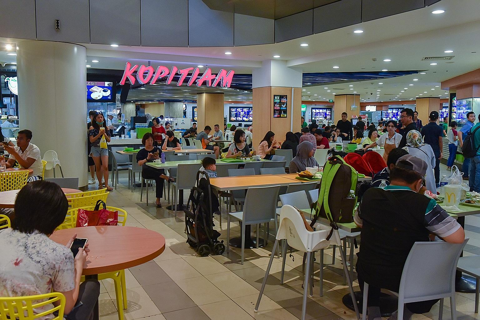 The Kopitiam foodcourt in VivoCity. NTUC Enterprise's promise to make affordable food more widely accessible with its expanded stable of outlets may be a tall order, say observers. The price of food, they say, is tied closely to its biggest operating