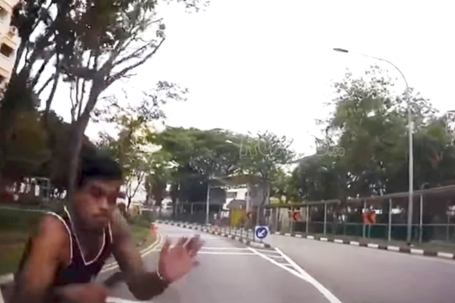 Dashboard-camera footage of the incident in Woodlands Ring Road shows the man running towards the oncoming car and throwing himself against its windscreen before falling to the ground.