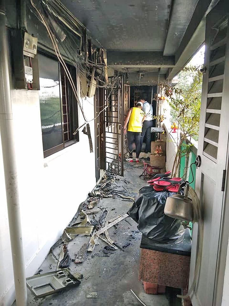 The aftermath of a fire that broke out at Block 235 Toa Payoh Lorong 8 yesterday. Neighbours rushed to the scene to help put out the fire. The Singapore Civil Defence Force finally extinguished the fire with a water jet.