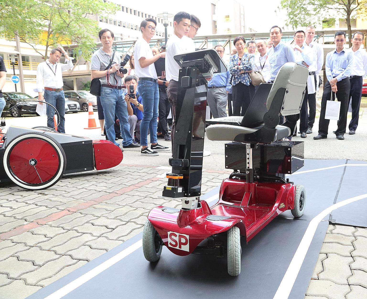 Engineering students from Singapore Polytechnic demonstrating how their project, SP Driverless And Electrifying Car, works at Singapore Polytechnic Engineering Show 2019 and 5G Garage opening event yesterday.