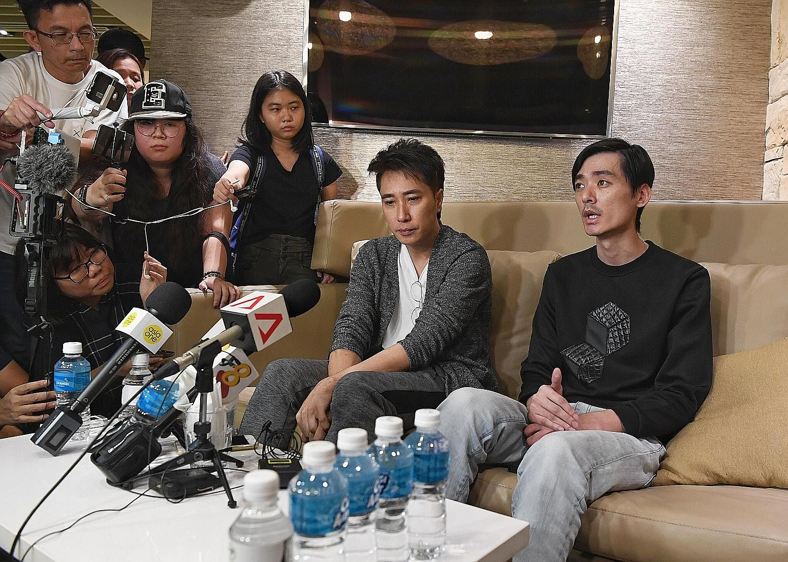 CFC Aloysius Pang was with two other personnel inside a howitzer when he was injured last Saturday. Singaporean actor Aloysius Pang's manager Dasmond Koh (left) and elder brother Kenny Pang speaking to the media at Changi Airport yesterday. Mr Koh sa