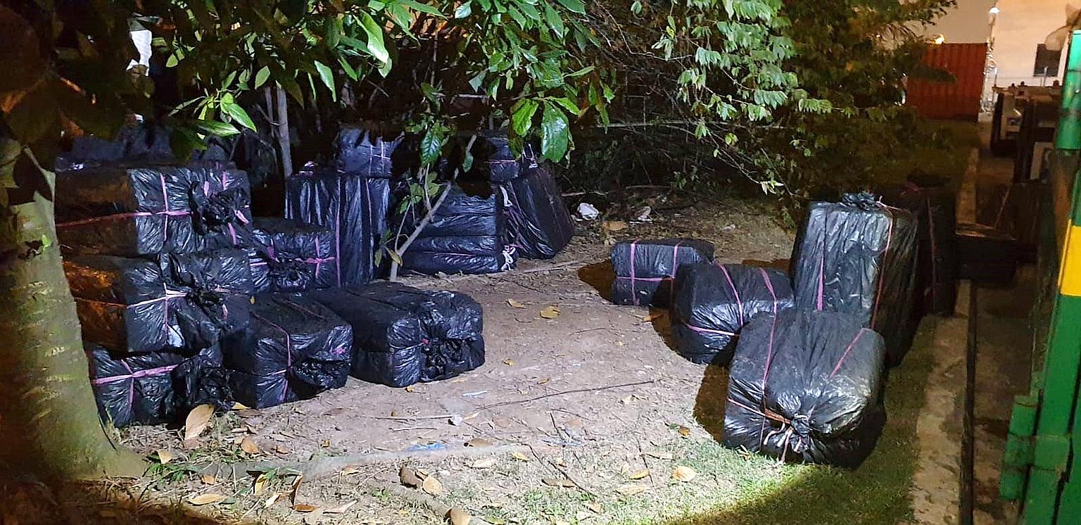 The men allegedly tried to smuggle 3,740 cartons and 448 packets of contraband cigarettes, which were seized, together with two foreign-registered supply vehicles and two Singapore-registered vehicles.