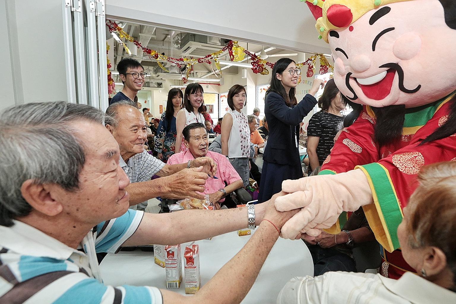 More than 60 senior citizens and 20 volunteers attended the event organised by SPH's Staff Volunteers Club. Software engineer Archimedes Rodil, who dressed up as the God of Fortune, said he could see the joy and hope in the eyes of the seniors as he