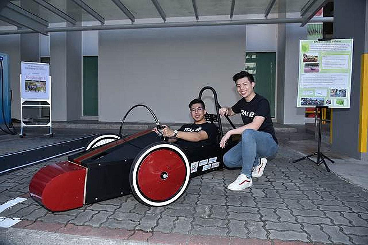 Singapore Polytechnic students showcasing their SP Driverless and Electrifying Car project at last month's launch of 5G Garage - a facility set up at the polytechnic by Singtel and Ericsson to test and develop 5G projects.