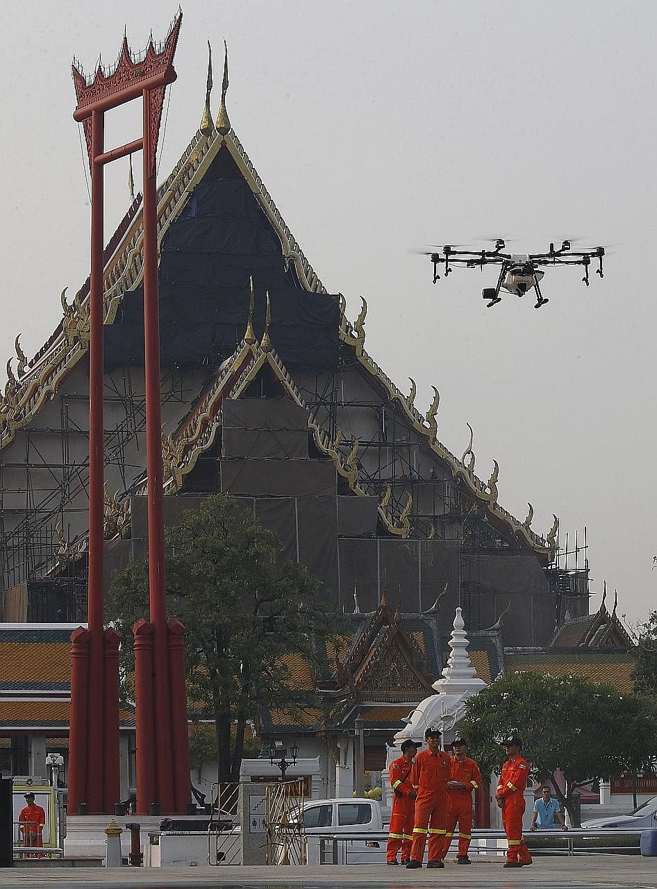 The Bangkok Metropolitan Administration is using drones to spray a water-based solution in the air to try and ease the effects of heavy smog.