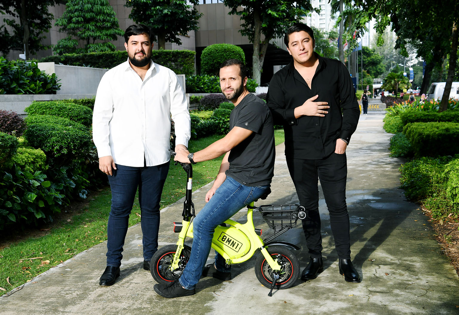 Omni Sharing directors Oscar Moises Chaves (left) and his brother Samuel (right), with chief operating officer Carlos Abarca. Omni yesterday applied for a sandbox licence to rent out 500 e-scooters here under the 0mn1 brand.