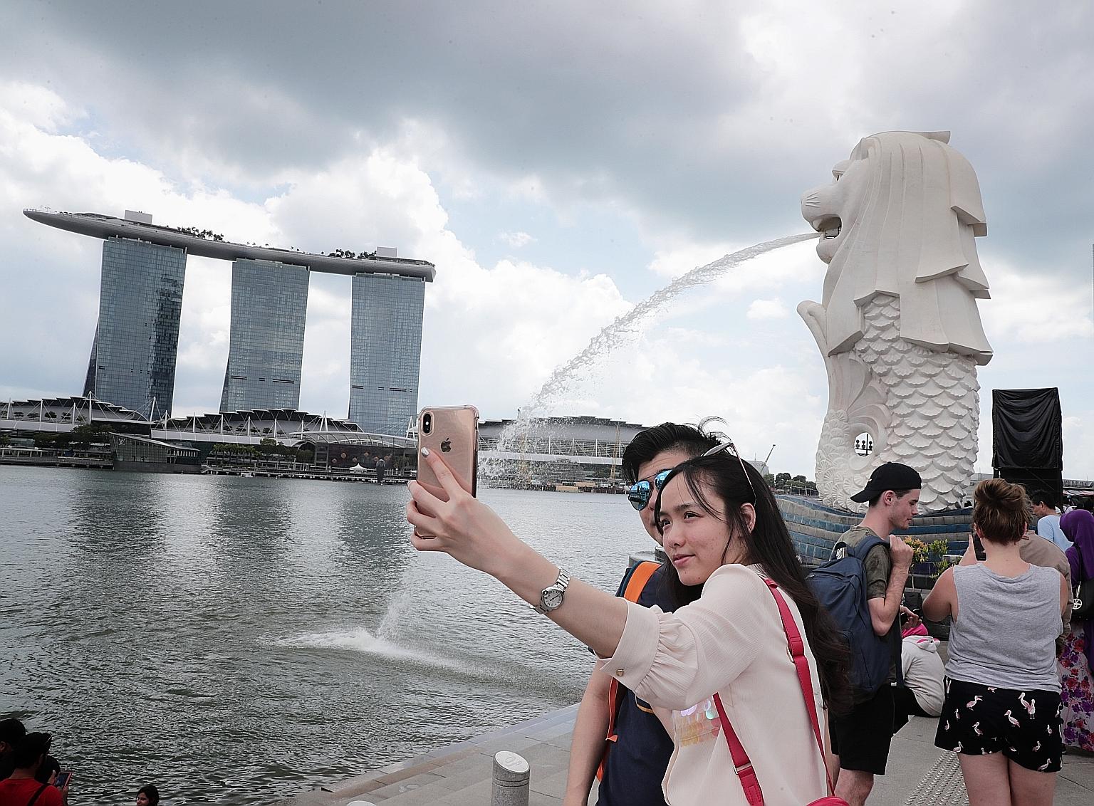 Married couple Tan Gui Ping and Lin Ming from Fujian, China, are visiting Singapore for the first time. China is the biggest source of tourists to Singapore, accounting for 3.4 million visitors who spent $3.16 billion between January and September la