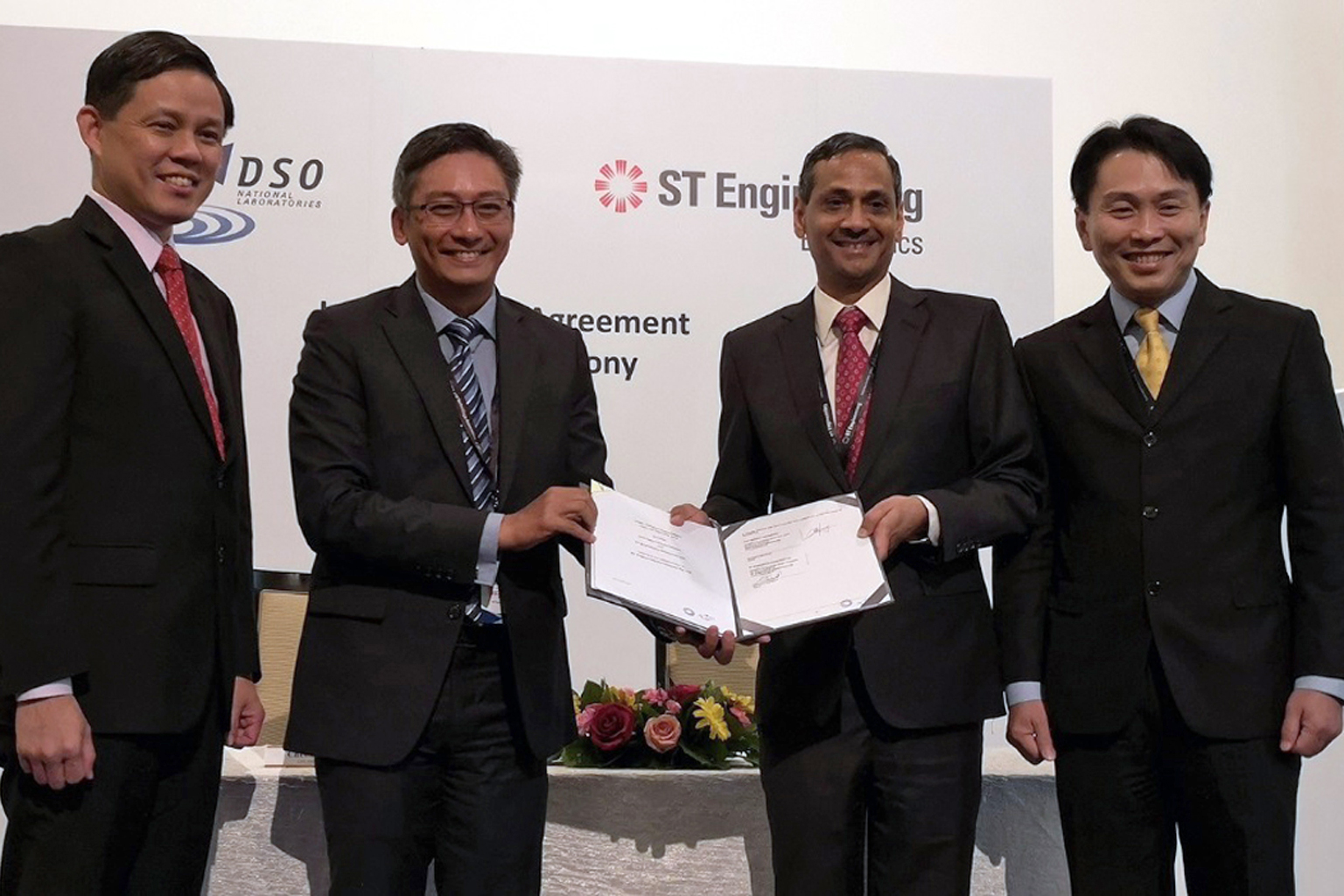 From far left: Minister for Trade and Industry Chan Chun Sing, DSO National Laboratories chief executive Cheong Chee Hoo, ST Engineering Electronics president Ravinder Singh, and ST Engineering president and CEO Vincent Chong at the signing of an agr