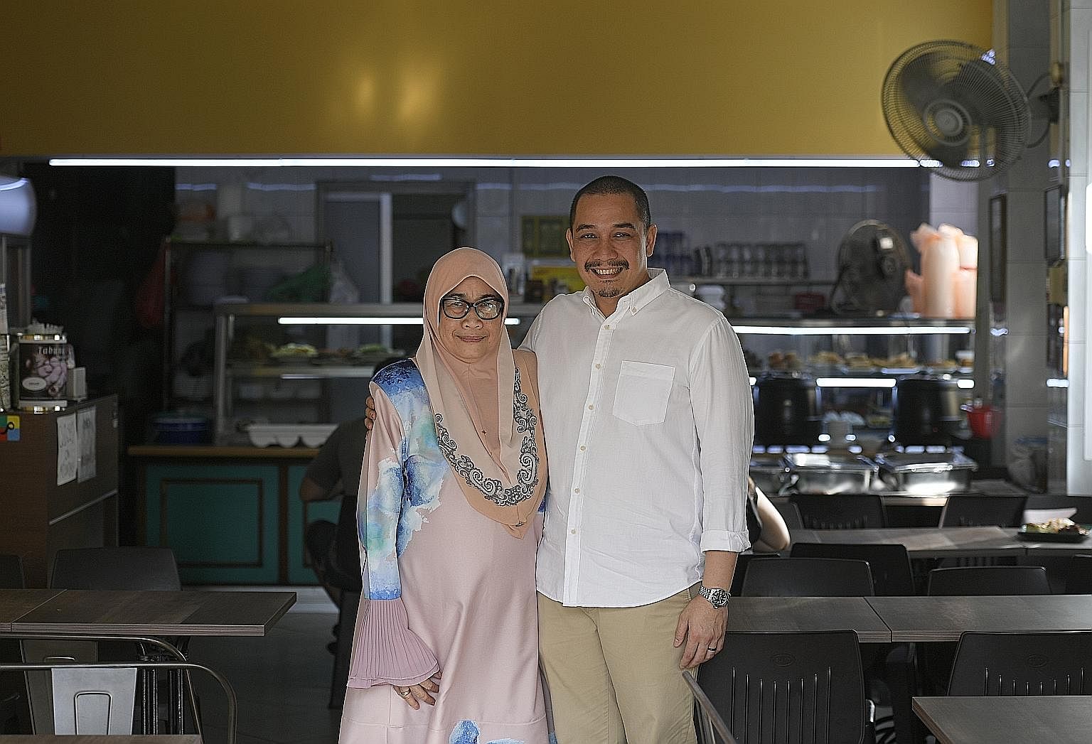 Ms Maryulis Bagindor Marlian (right), who helms Sabar Menanti in North Bridge Road, with her son Iszahar Tambunan, who helps out on Sundays. He is hoping to expand the business.