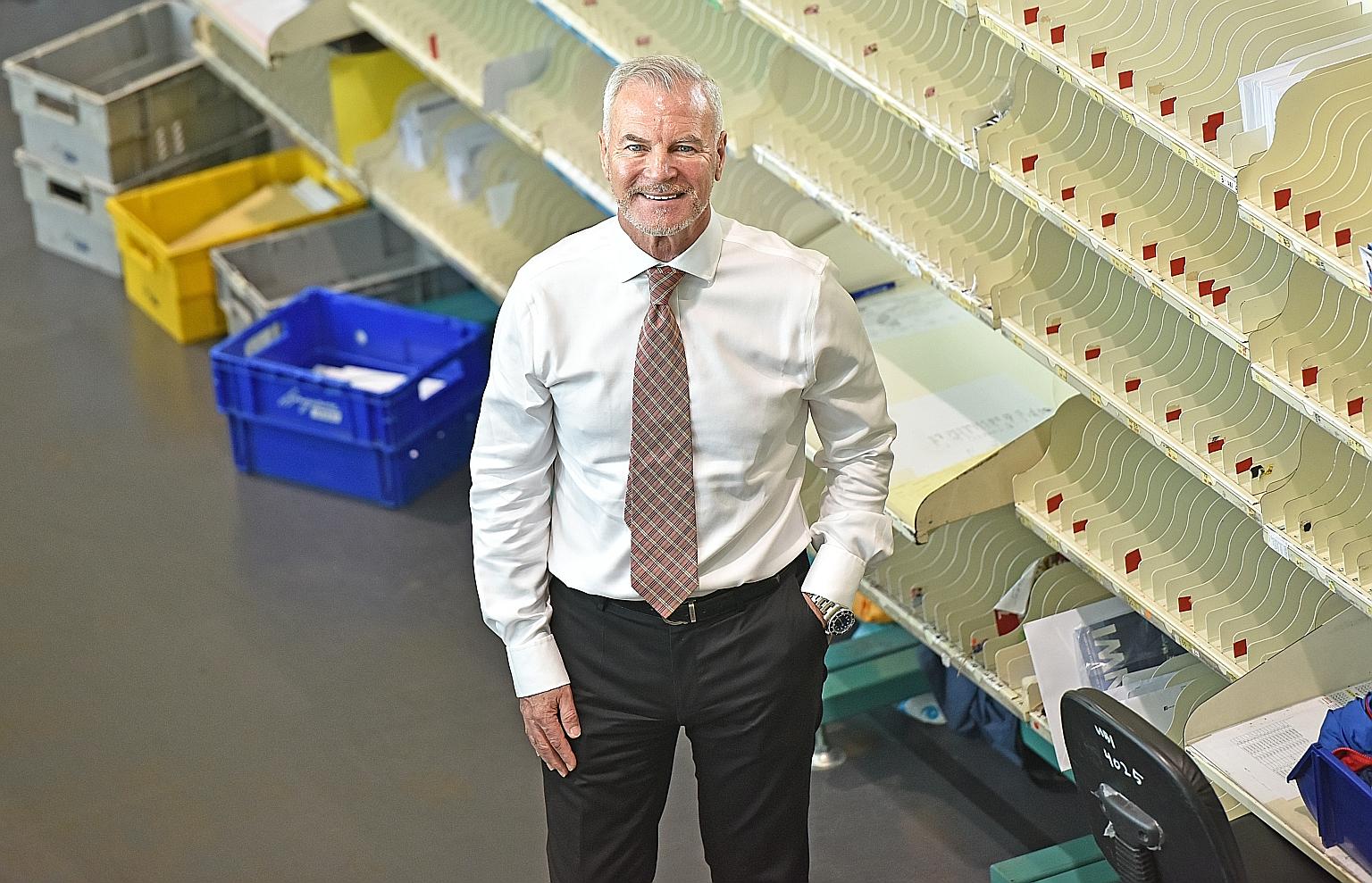 SingPost group chief executive Paul Coutts in the mail room at SingPost Centre. Mr Coutts said the surge in e-commerce volumes exposed weaknesses in SingPost's infrastructure and processes.