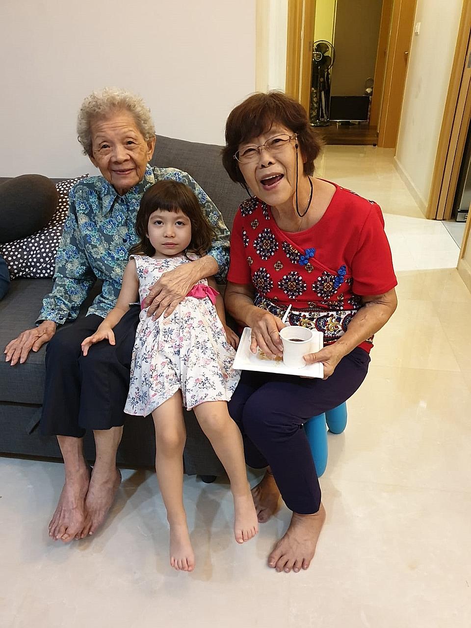 Madam Margaret Yeo with her mother, Madam Ng Guan Cheng, and her granddaughter, Alyx Raja Poh. Madam Yeo, who does not have space at home for a maid, believes the pilot scheme will be a big help, as long as the nursing home is nearby.