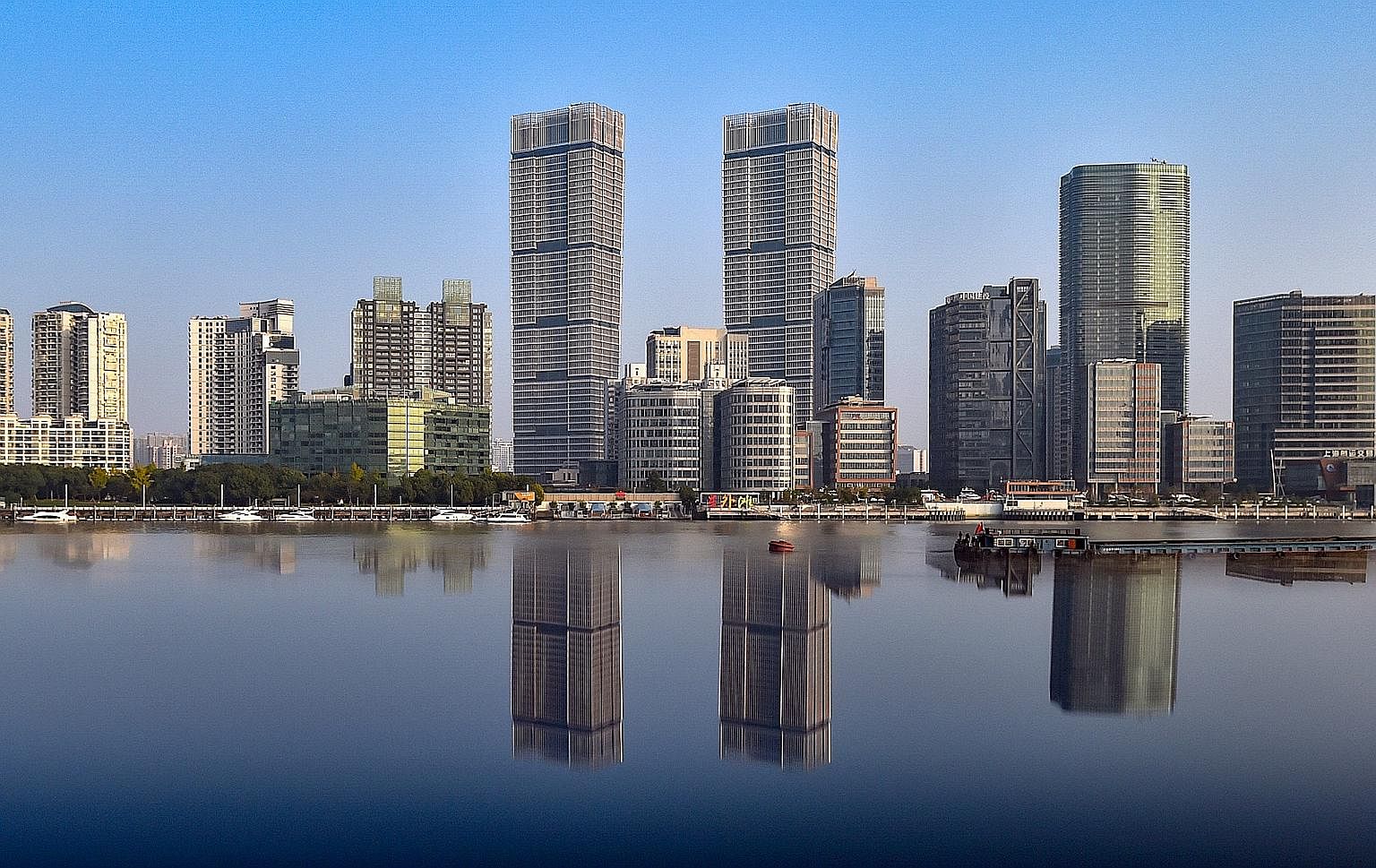CapitaLand acquired Shanghai's tallest twin towers (left) through a 50:50 joint venture between GIC and Raffles City China Investment Partners III fund. The firm's significant acquisitions in developed markets outside Singapore last year included the