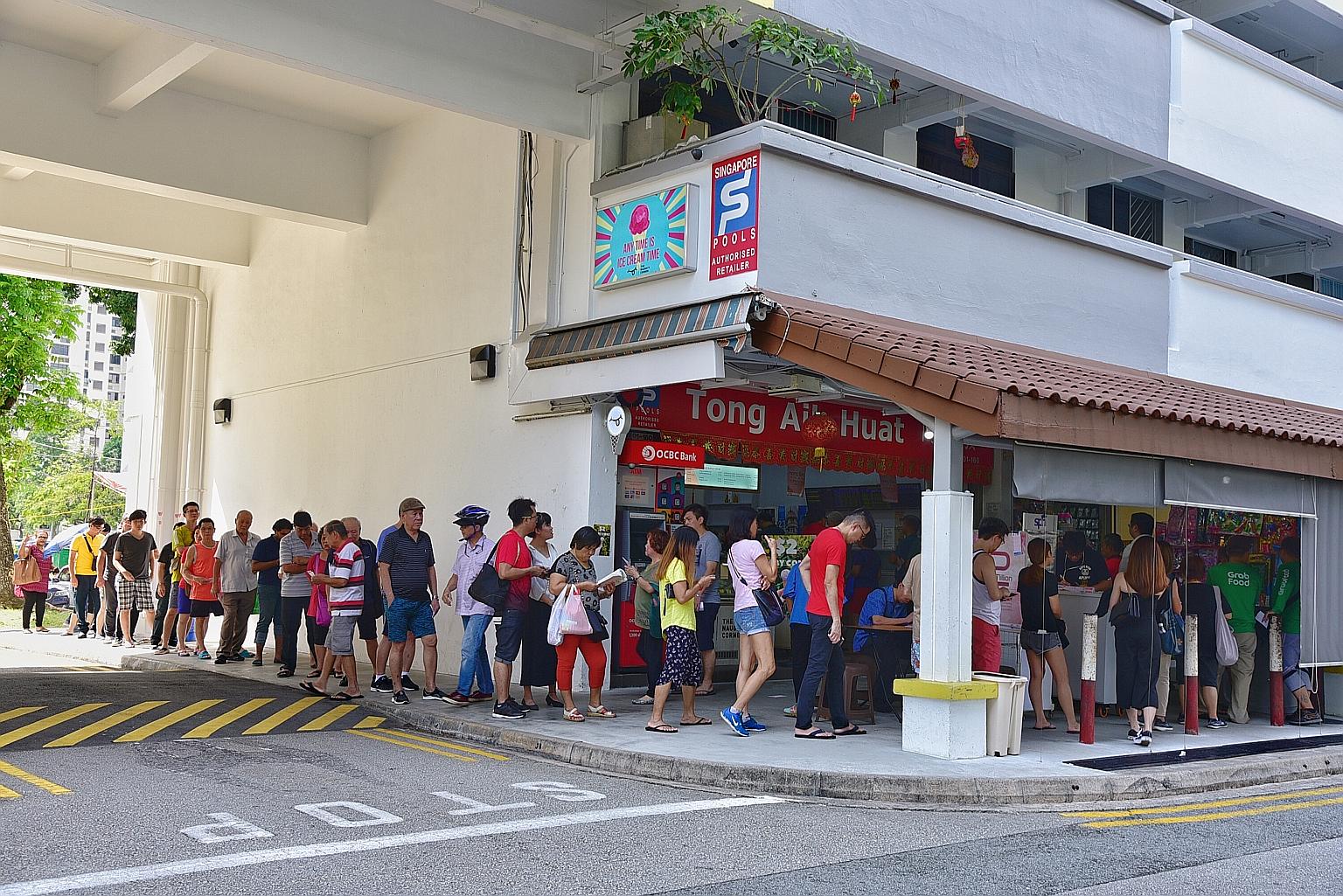 People queueing up yesterday at Block 685 Hougang Street 61 for tickets for today's Toto Hong Bao Draw. Today's draw is one of the biggest Toto Hong Bao Draws, at an estimated $13.6 million. According to the Singapore Pools website, the biggest such 