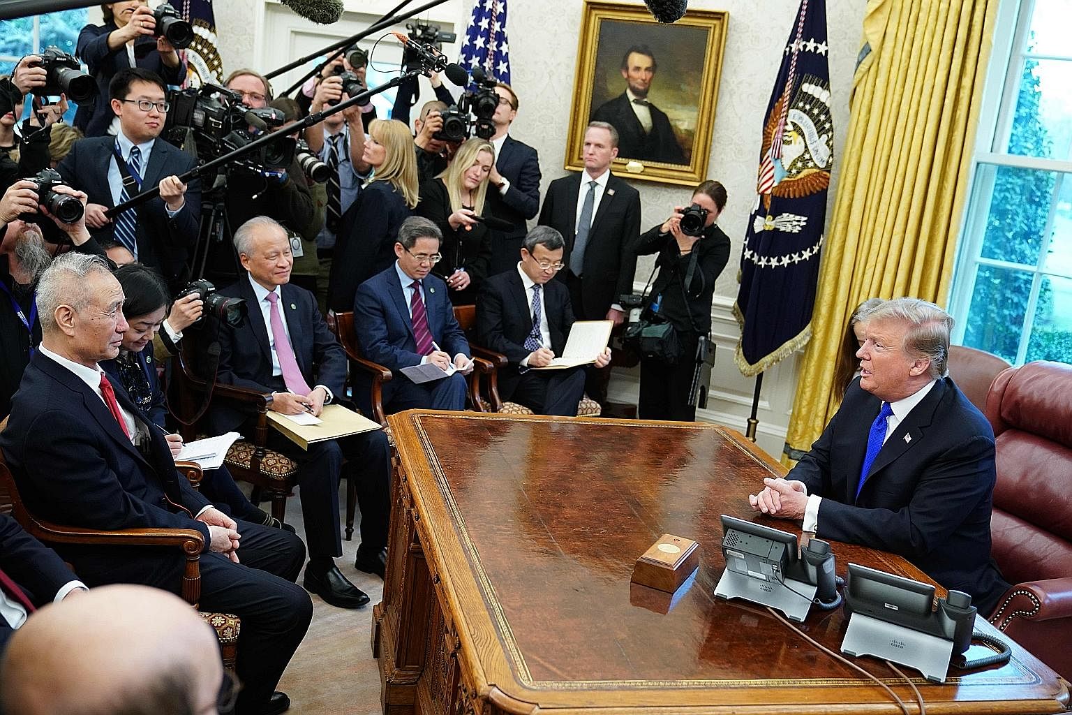 US President Donald Trump in a meeting with China's Vice-Premier Liu He (far left) in the White House's Oval Office on Friday.
