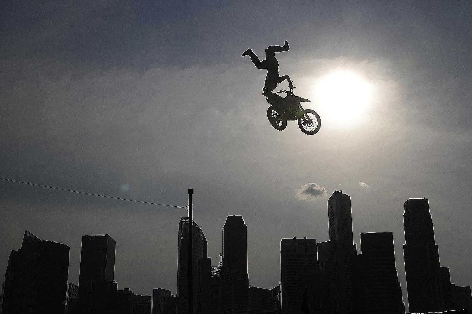 Endah (at right), the six-year-old granddaughter of the Singapore Zoo's legendary Ah Meng, stretching herself in the sun next to Joko (far left), also six, at the free-ranging enclosure for orang utans on Dec 26. Both orang utans were born at the zoo