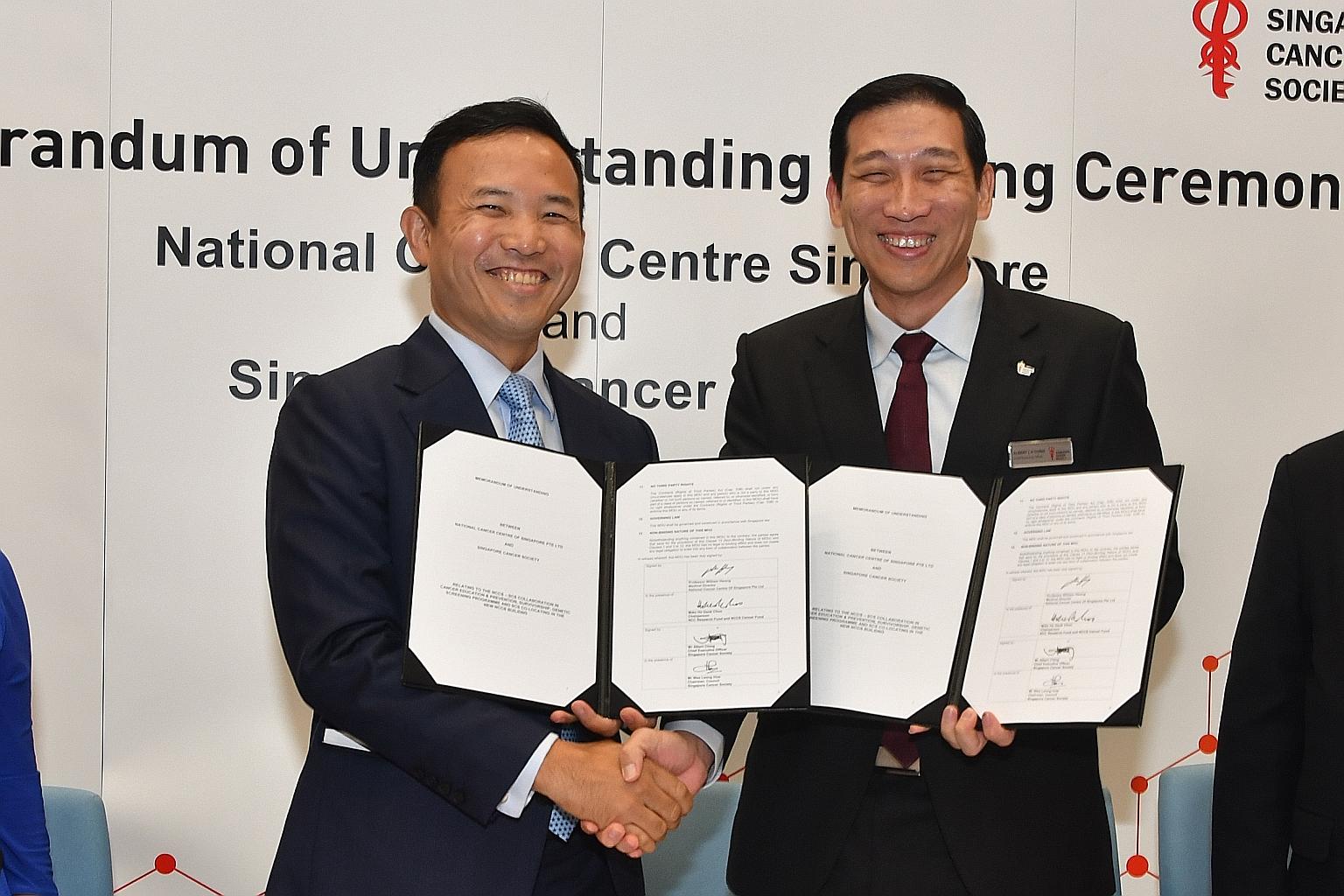 National Cancer Centre Singapore medical director William Hwang (left) and Singapore Cancer Society chief executive Albert Ching at the signing of a memorandum of understanding yesterday.