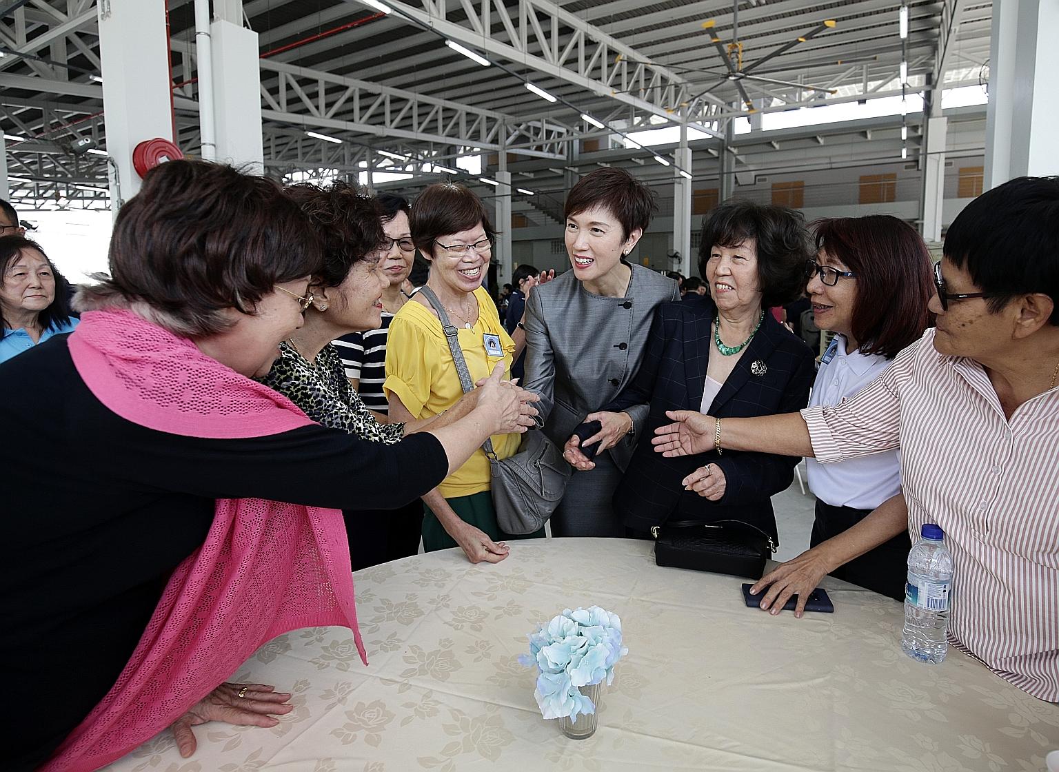 Manpower Minister Josephine Teo and her mother, Madam Leow Chee Chu (third from right), at yesterday's event at the Home Team Academy. Around 650 officers, volunteer police personnel and retirees were also present at the event to celebrate 70 years o
