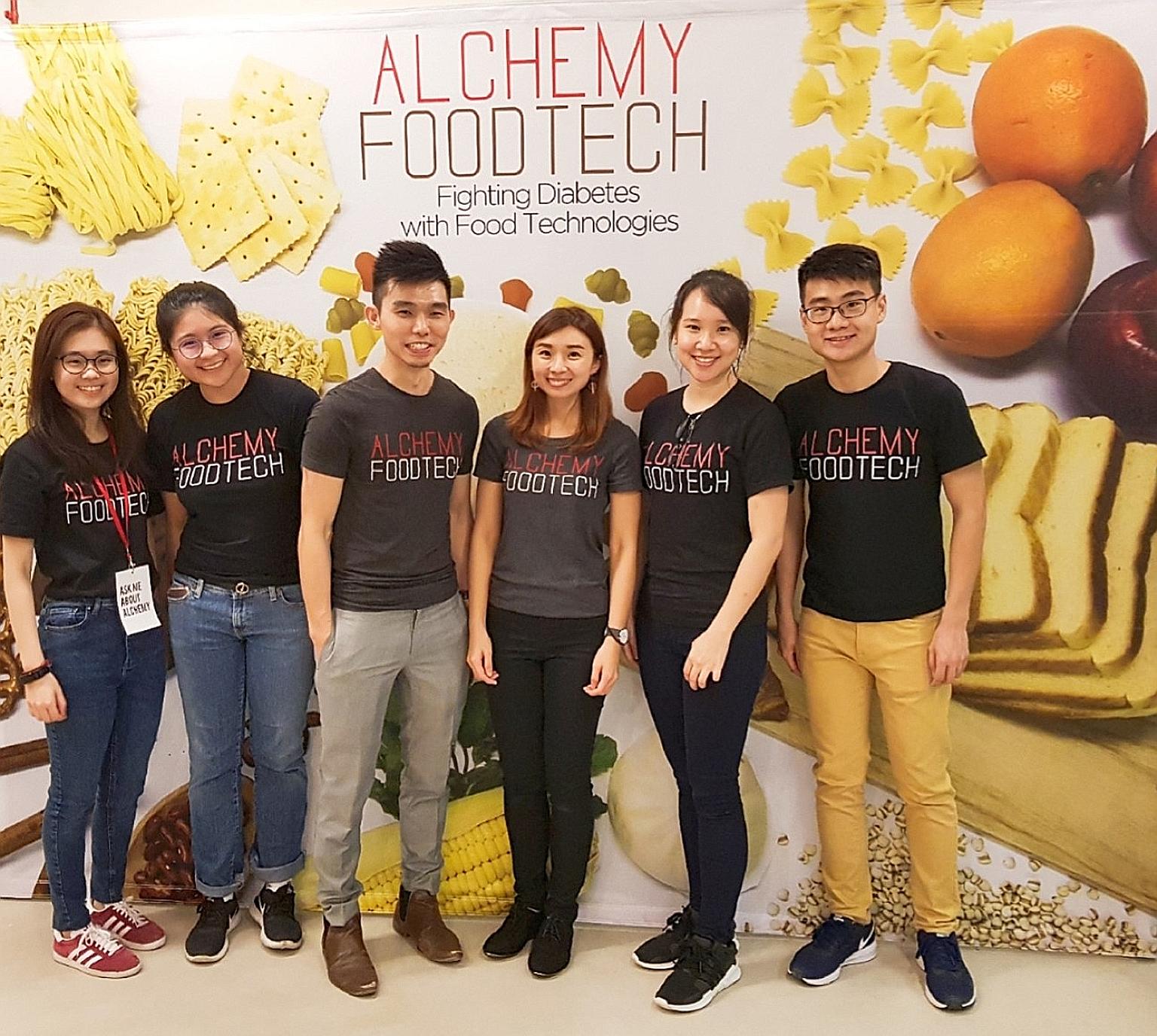 Mr Alan Phua (third from left) and Ms Verleen Goh (fourth from left), co-founders of local start-up Alchemy Foodtech, with their team. Mr Phua said an Enterprise Singapore grant helped his firm take its food technology to market when there was no cer