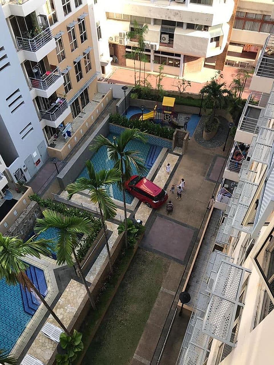 The red Honda Shuttle was reported to be a private-hire vehicle that had driven into the condominium compound on Sunday to pick up a passenger.