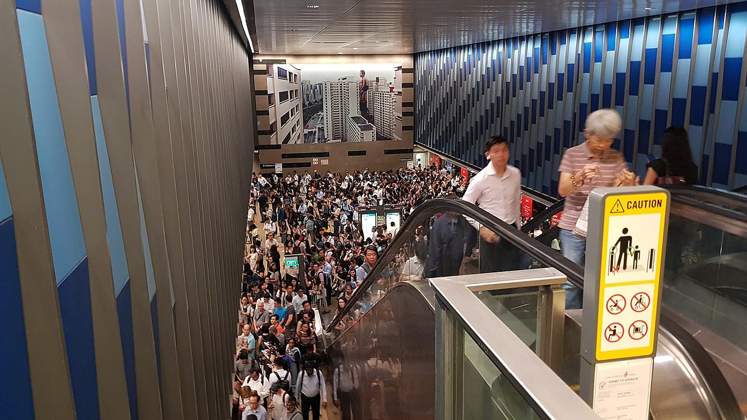 Commuters packing the Bukit Panjang MRT station yesterday. Service was delayed from as early as 7.45 am and operations started to return to normal just after 9am.