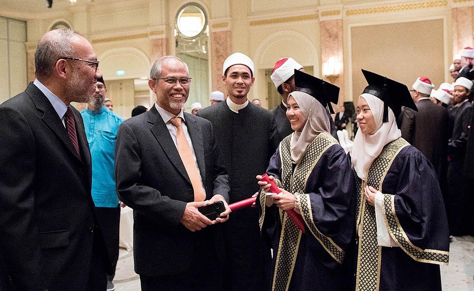 Minister-in-charge of Muslim Affairs Masagos Zulkifli with Singaporean students at Egypt's Al-Azhar University. Muis is stepping up efforts to engage overseas graduates and also introducing student liaison officers who will mentor the 800 Singaporean