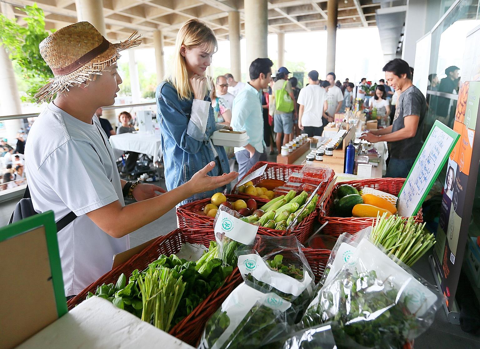 Locally grown organic produce on sale at an event at the Marina Barrage last year. Environment and Water Resources Minister Masagos Zulkifli unveiled the ambitious target of locally producing almost one-third of the food that Singapore needs by 2030.
