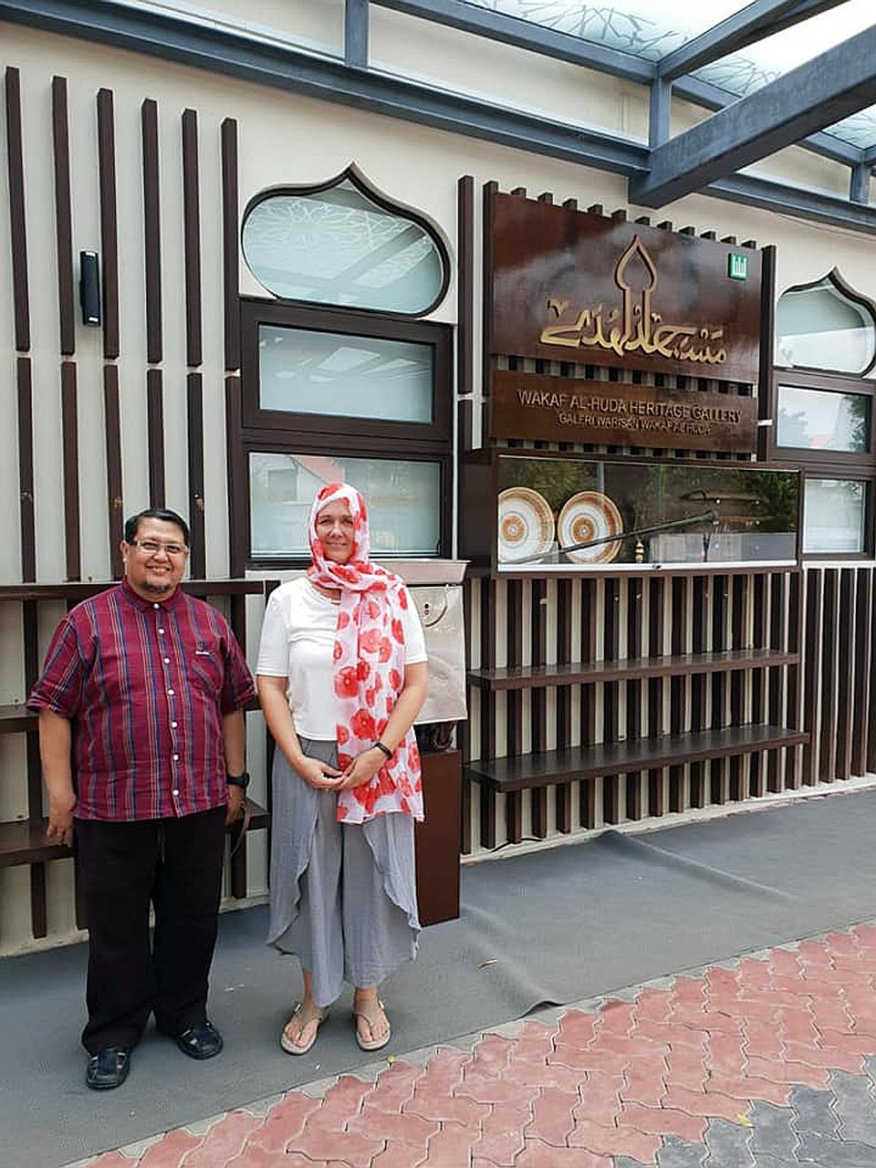 Al-Huda Mosque chairman Azman Kassim with New Zealander Kim Forrester, who paid a visit to the mosque in Bukit Timah yesterday to apologise and pray for the safety and prosperity of all Muslims.