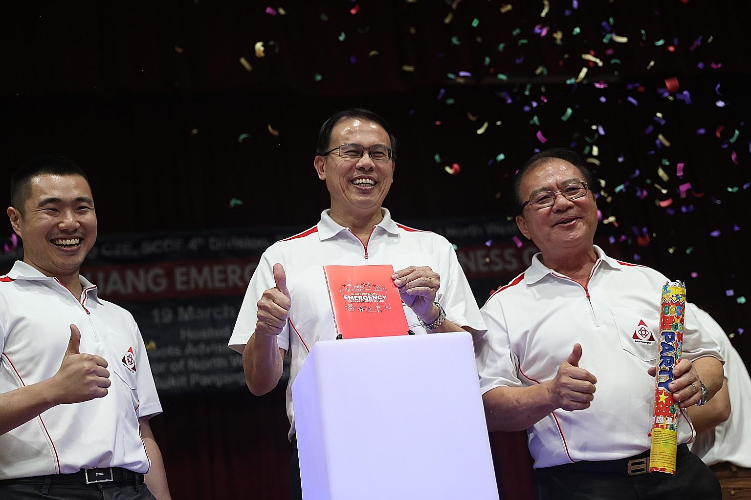 Bukit Panjang MP Teo Ho Pin (centre) launching the Bukit Panjang Emergency Preparedness Guide yesterday with Mr Jonathan Tan (far left), chairman of the team behind the guide, and Bukit Panjang Community Emergency and Engagement Committee chairman Ta