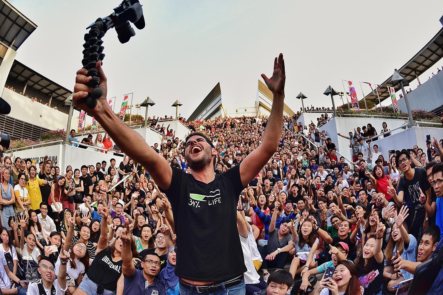 Mr Nuseir Yassin taking a wefie with his followers outside the Singapore Indoor Stadium last year. He is planning a summit here on April 20 to meet his followers and fellow content creators and creatives.