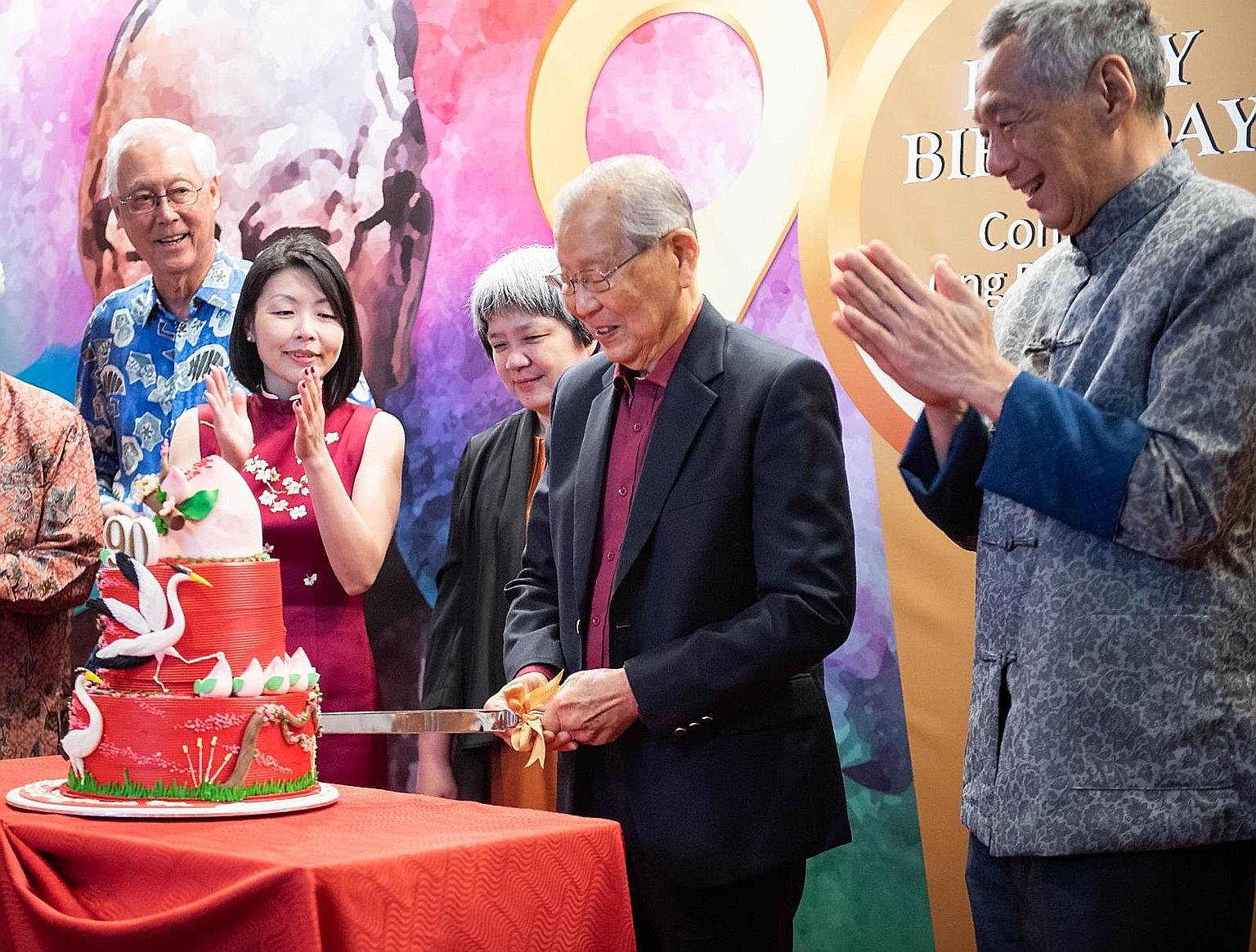 Mr Ong Pang Boon cutting his birthday cake with (from left) Emeritus Senior Minister Goh Chok Tong, Fengshan MP Cheryl Chan, who is the niece of Mr Ong's late wife, Mr Ong's eldest daughter Ong Juey Ming, and Prime Minister Lee Hsien Loong at Mr Ong'