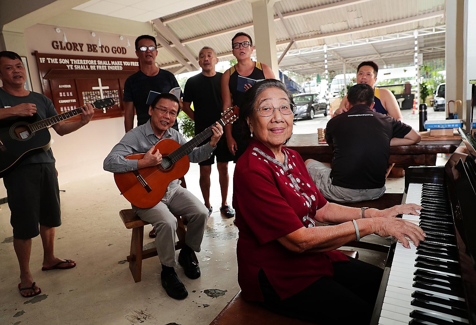 Madam Khaw Seow Wah playing worship songs with Pastor Simon Neo (seated with guitar) as well as residents and staff of Christian halfway house Breakthrough Missions. Madam Khaw, a long-time volunteer at the halfway house, has helped to reconcile more