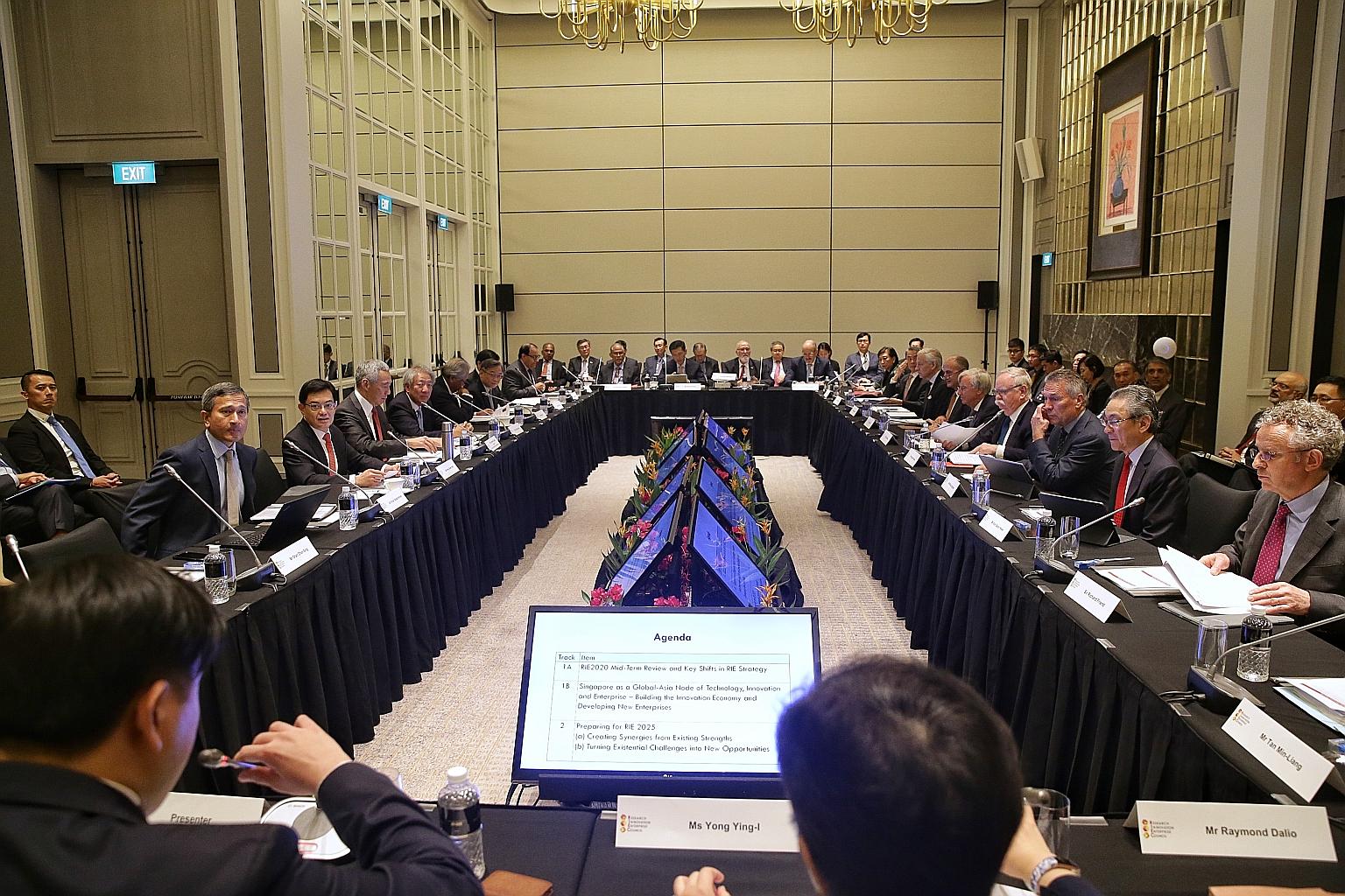 Prime Minister Lee Hsien Loong (middle of left row) chairing the Research, Innovation and Enterprise Council meeting at The St Regis Singapore hotel yesterday. With him were Foreign Minister Vivian Balakrishnan, Finance Minister Heng Swee Keat, Deput