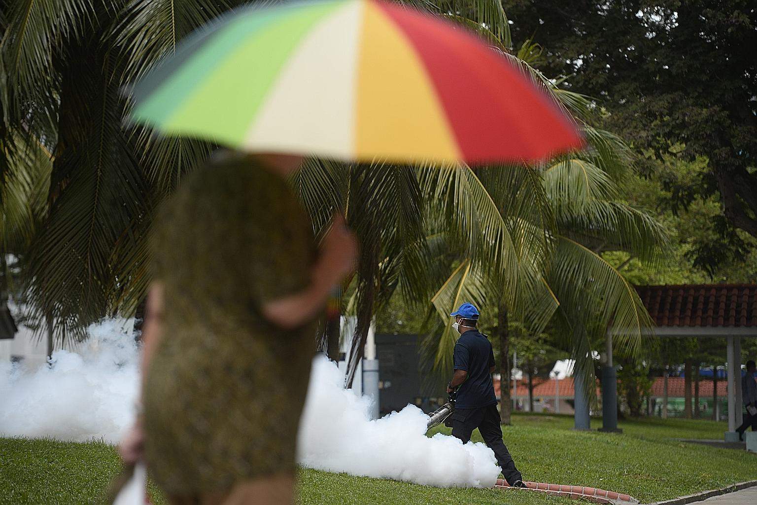 A worker at a waste oil recycling plant cleans a tank without proper protective gear. A worker carries out fogging near Block 409 at Bedok North Avenue 2 wearing only a surgical mask, which is unable to prevent the inhalation of chemical emissions.