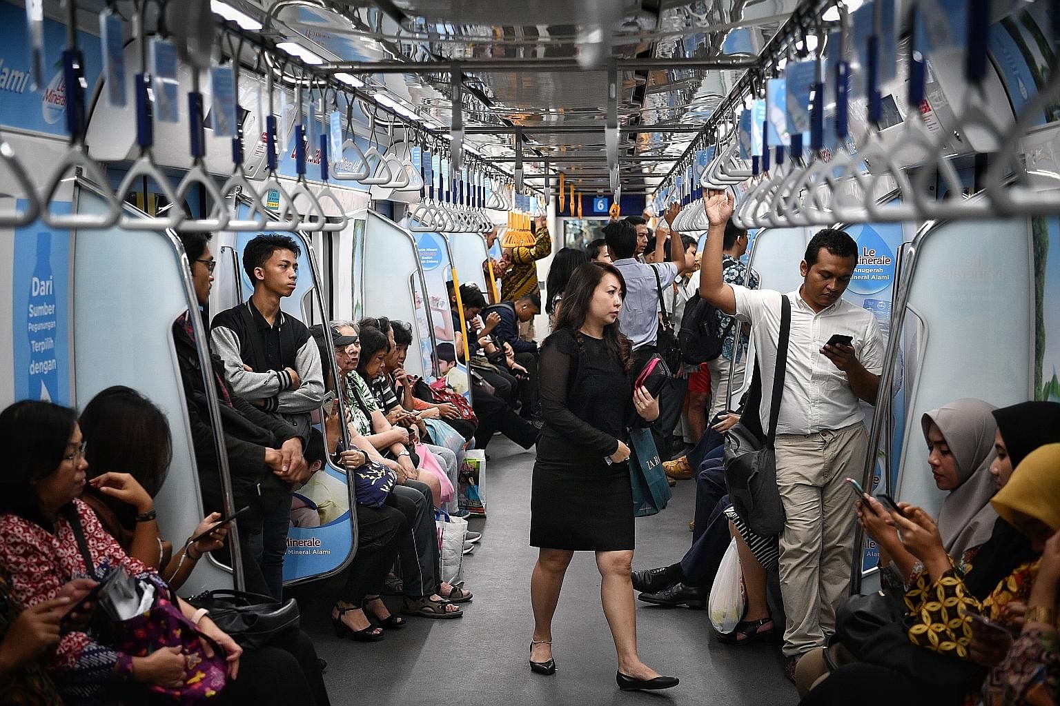 Commuters on a Jakarta subway train yesterday. The MRT has been highly politicised, with President Joko Widodo lauded for his role in pushing the project through while he was Jakarta governor from 2012 to 2014. But his detractors say credit should go
